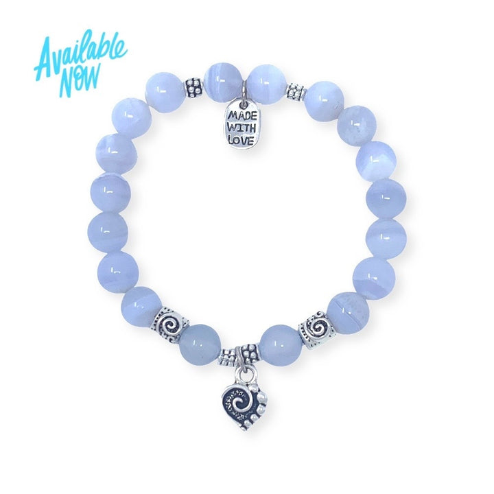 This design features blue chalcedony beads, a heart pendant and silver accent spacer beads that make this sparkle. The heart charm features a spiral center and dots to represent the mind, body & spirit. A reminder to be in love with all three aspects of your Self.