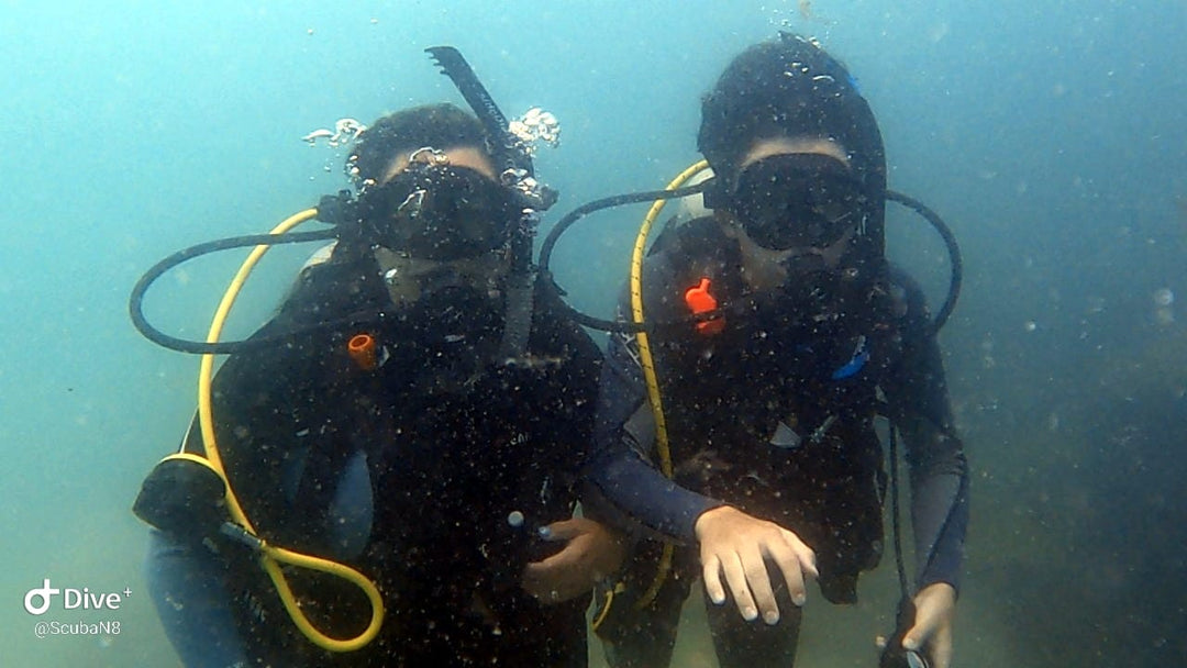 two scuba divers underwater