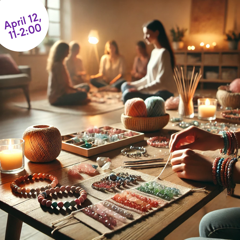 Crystal bracelet workshop with gemstones, beads, candles, and people in a cozy room