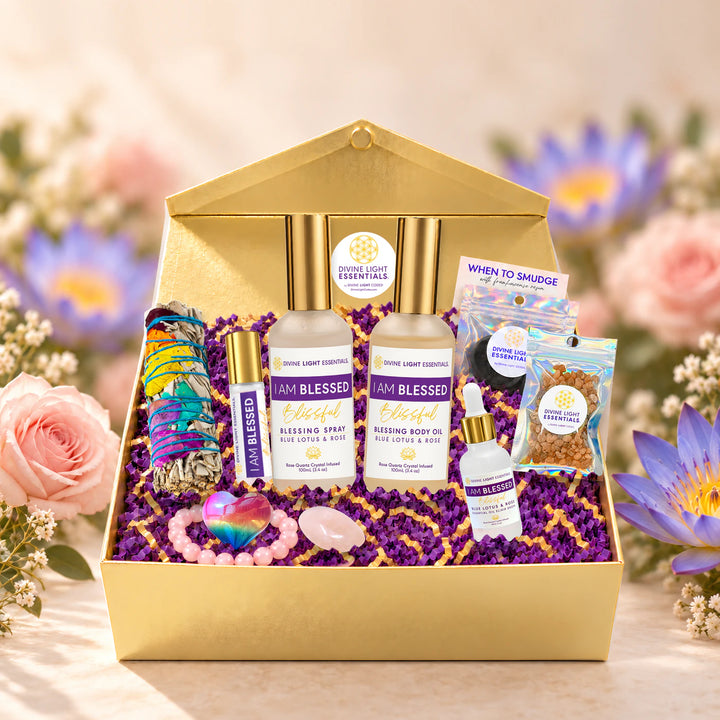 I Am Blessed wellness gift set in a gold box surrounded by roses and blue lotus flowers.