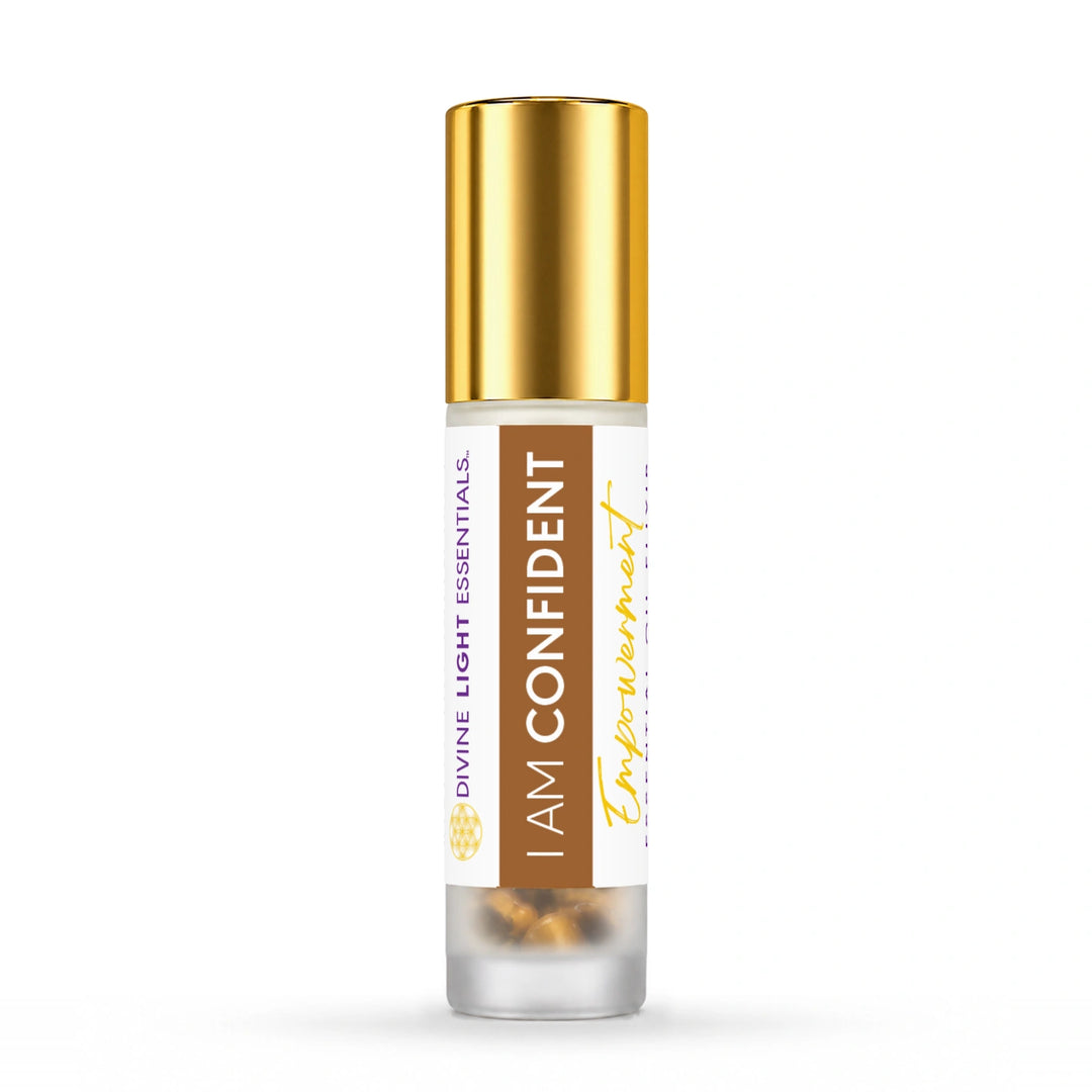 Gold-capped I Am Confident essential oil roller bottle on white.