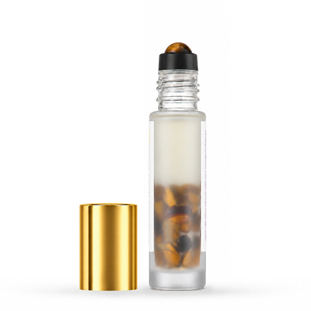 Uncapped rear view of I Am Confident showing yellow tiger eye inside the bottle, with its gold cap beside it.