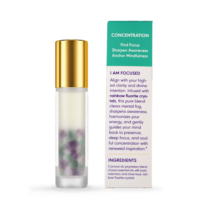 Rear view of the I Am Focused crystal infused roller bottle beside the back of its carton, showing the concentration message and ingredients.