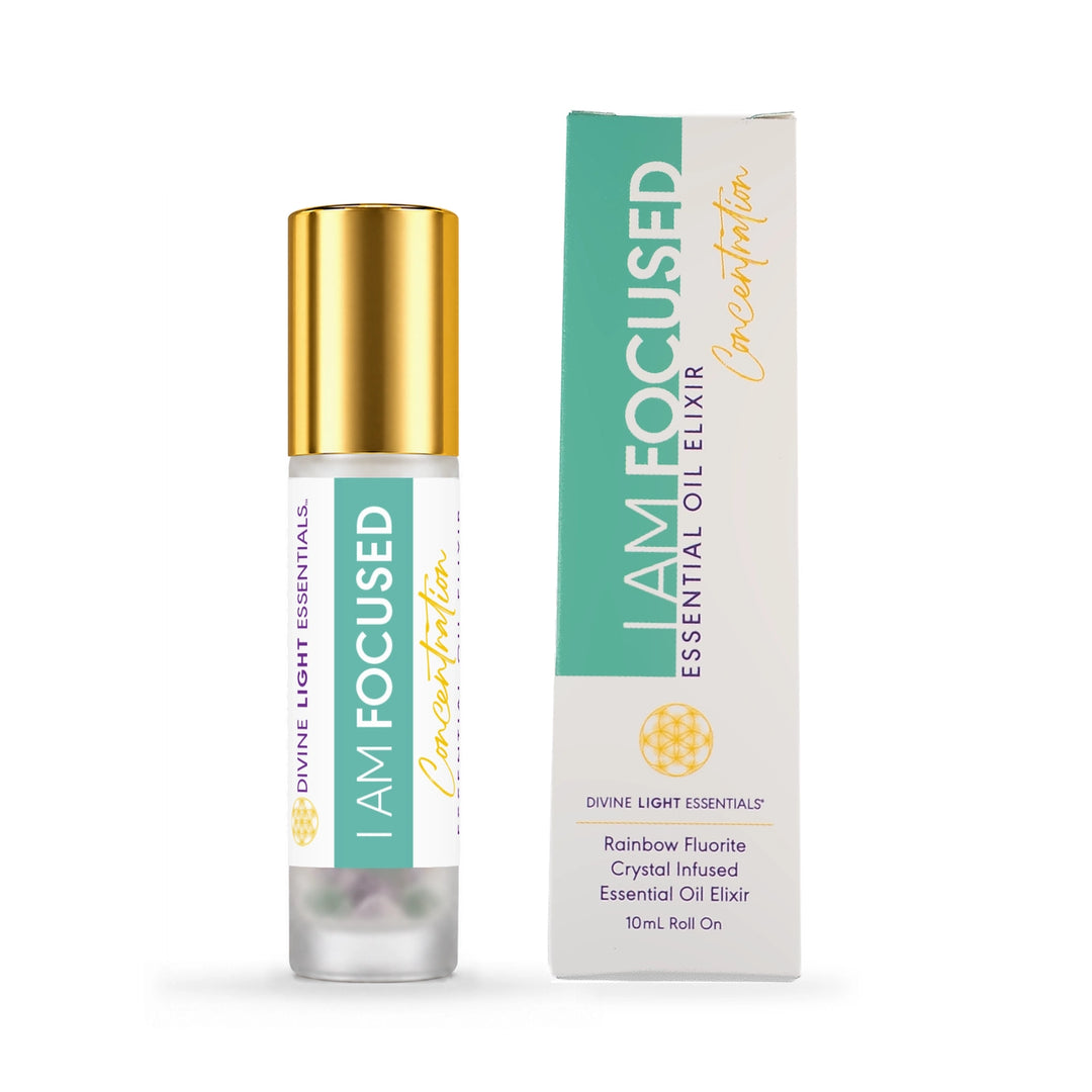 I Am Focused essential oil elixir roller bottle with gold cap beside the front of its mint green and white carton.
