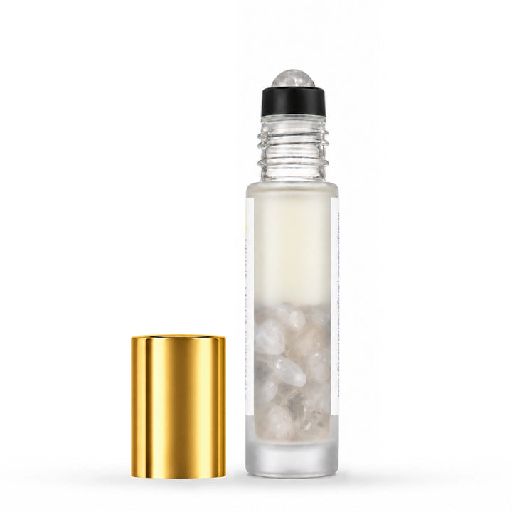Uncapped rear view of I Am Peaceful showing clear quartz inside the bottle, with its gold cap beside it.