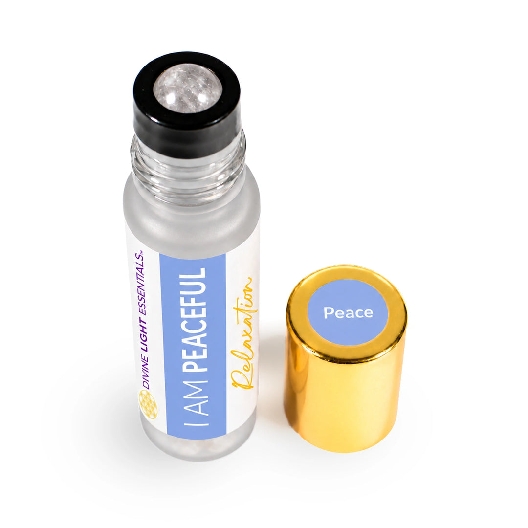 Angled top view of I Am Peaceful showing its clear quartz rollerball and gold cap.