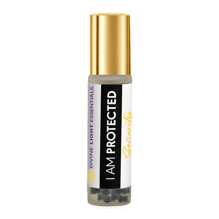 A small cylindrical bottle with a shiny gold cap and a white label reading &