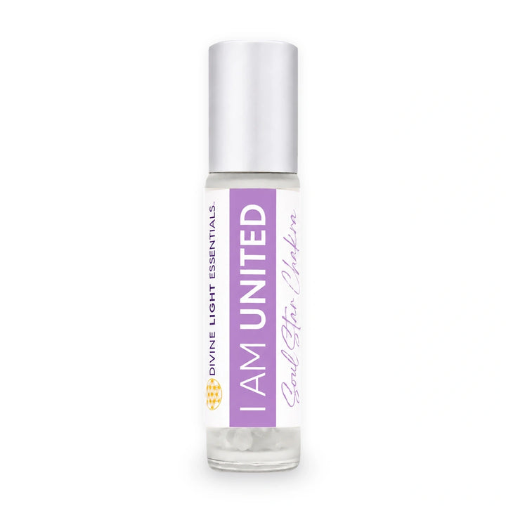 A clear glass roll-on bottle with a silver cap, featuring a white and purple label that reads &