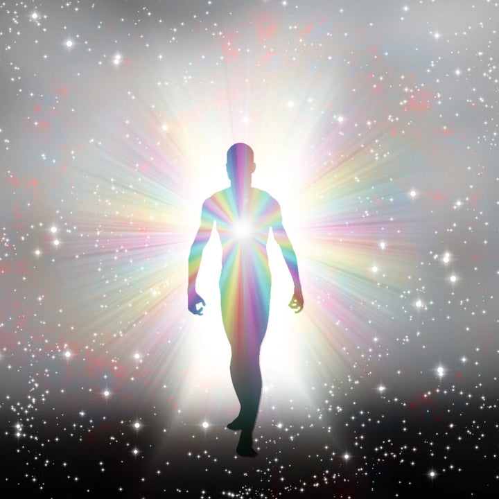 Silhouette of a person radiating rainbow light in a starry cosmic space, symbolizing spiritual awakening and ascension.