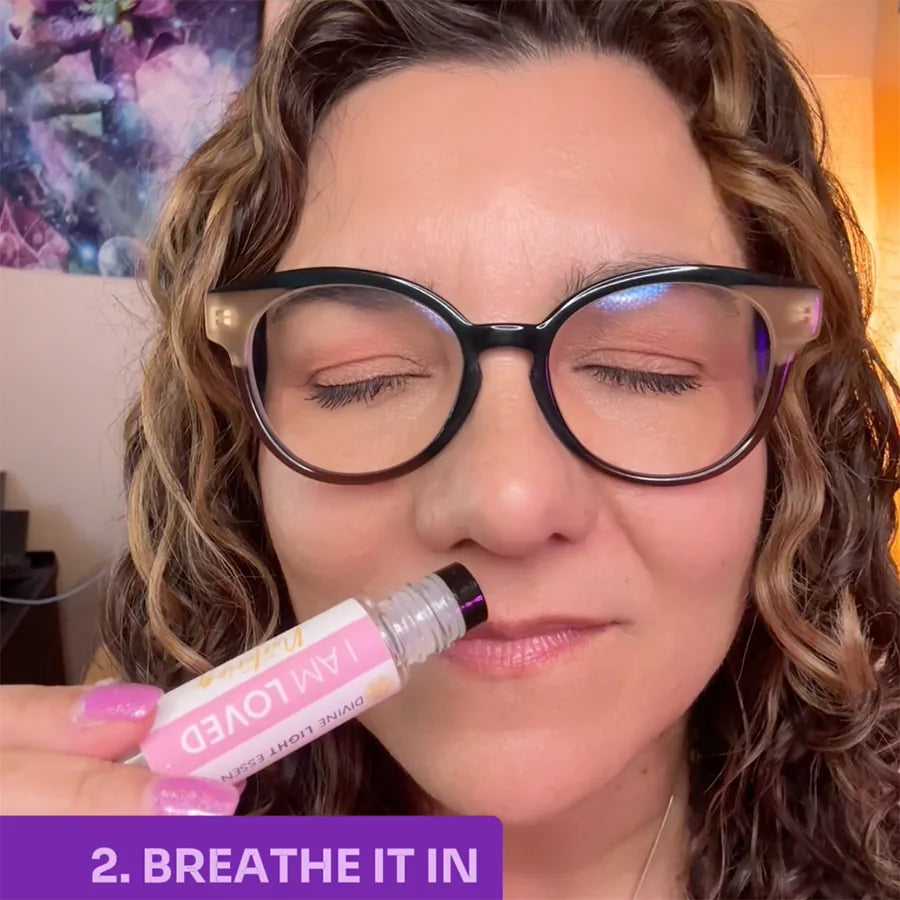 Cheri inhaling the I Am Loved essential oil elixir