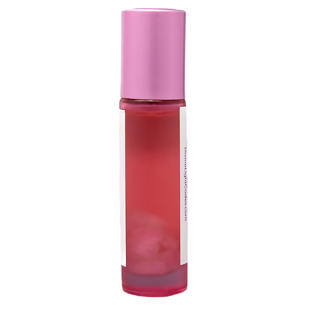 A cosmetic roller bottle filled with pink liquid, featuring a metallic pink cap and a white label with vertical text, isolated on a white background.