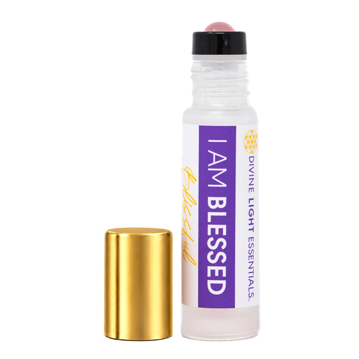 A clear glass roll-on bottle with a white label reading &