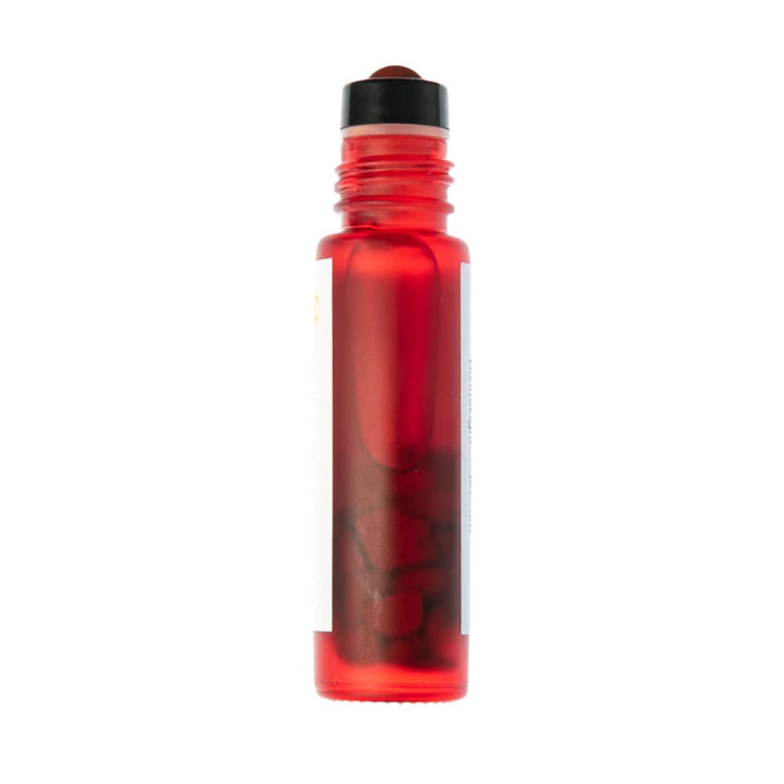 Red rollerball bottle with black cap, containing healing essence for spiritual ascension and light beings
