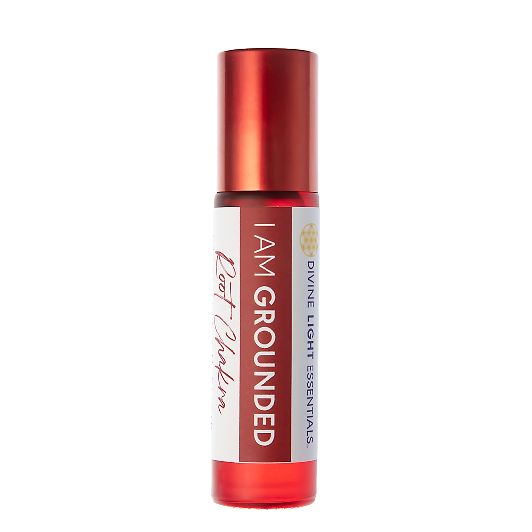 A red roll-on bottle with a white label reading 'I AM GROUNDED' and 'Root Mantra' by Divine Light Essentials, shown on a plain white background.