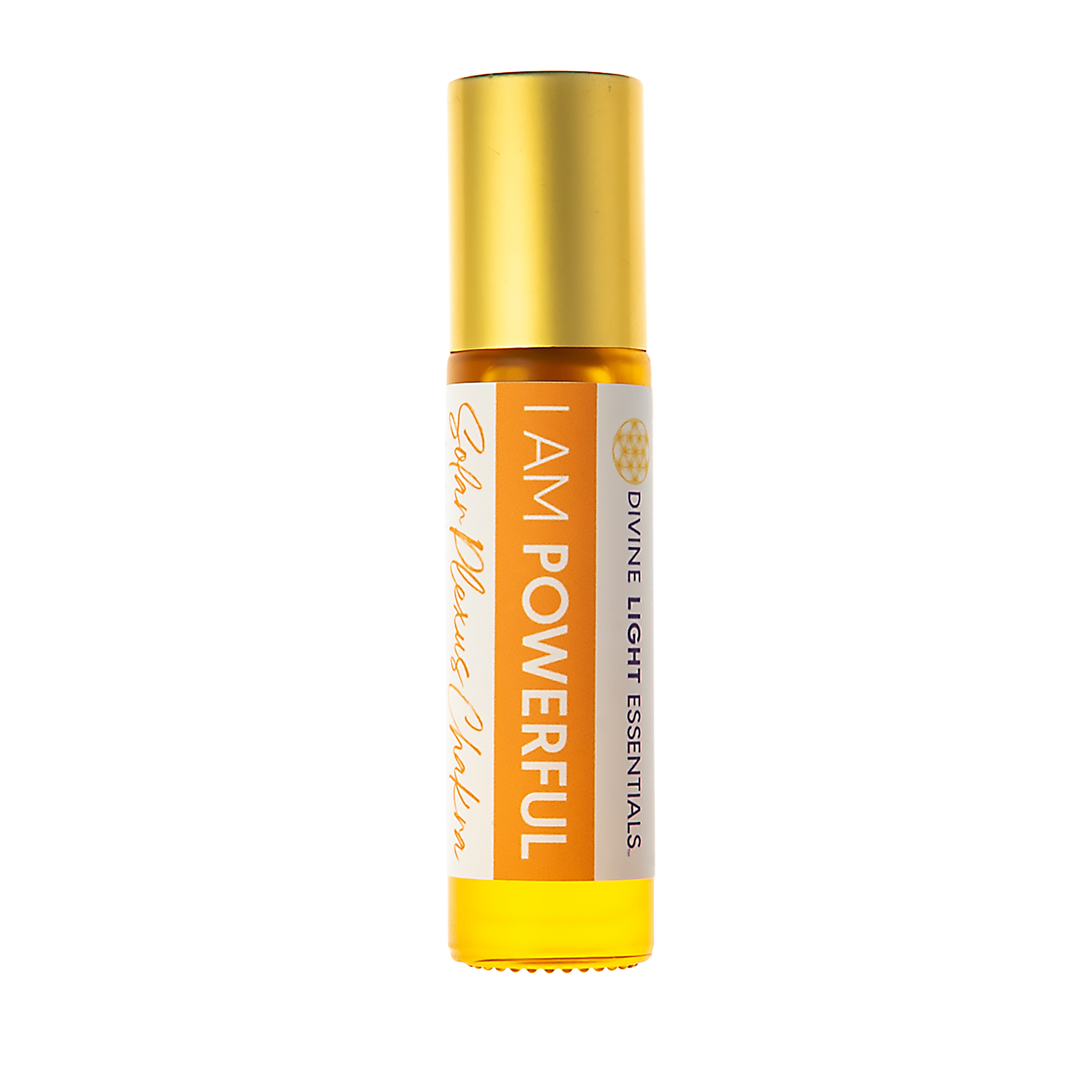 A roll-on bottle of Divine Light Essentials 'I AM POWERFUL' essential oil with a gold cap and white and orange label, set against a plain white background.