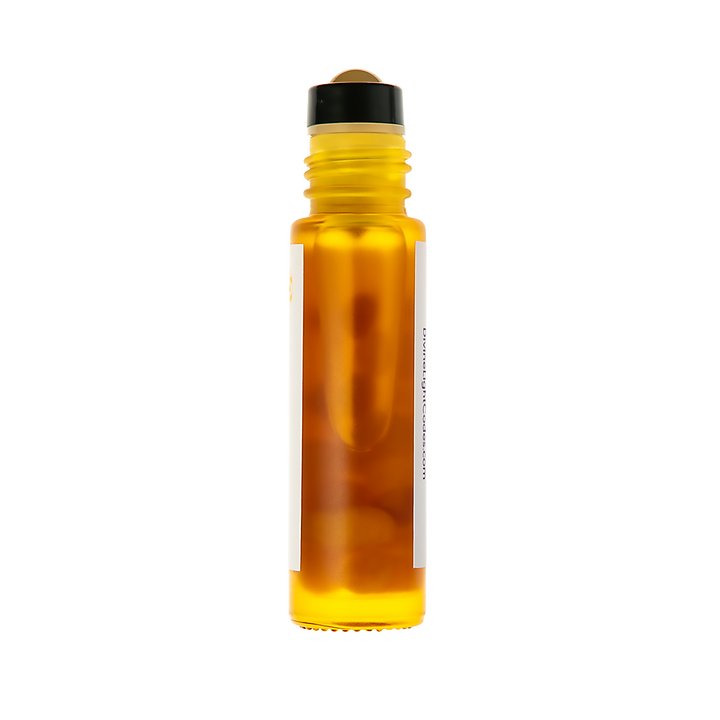 An amber glass roller bottle filled with golden-yellow liquid, featuring a black cap and a blank white label, isolated on a white background.