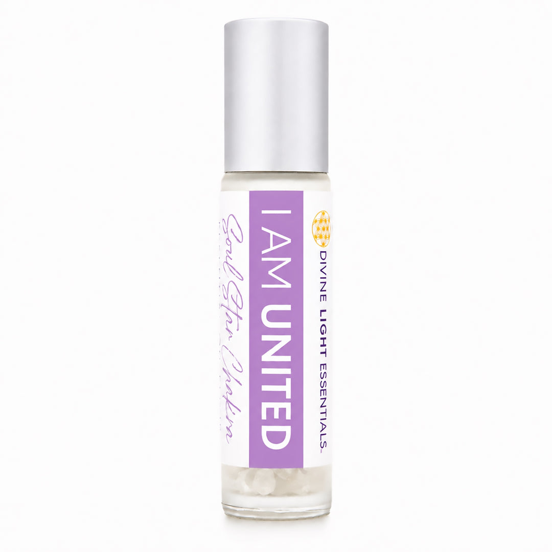 A clear glass roll-on bottle with a silver cap, featuring a white and purple label that reads 'I AM UNITED' and 'God Given Power' by Divine Light Essentials.