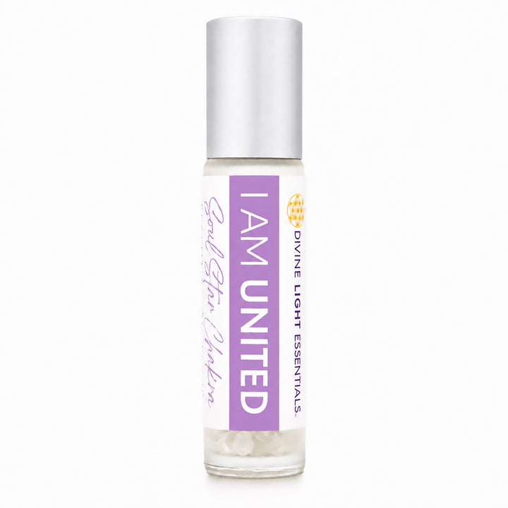 A clear glass roll-on bottle with a silver cap, featuring a white and purple label that reads &