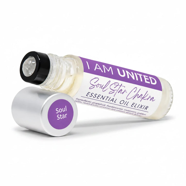 A glass roller bottle of Soul Star Chakra essential oil elixir by I AM UNITED, shown with its silver cap removed and placed beside it on a clean white background.