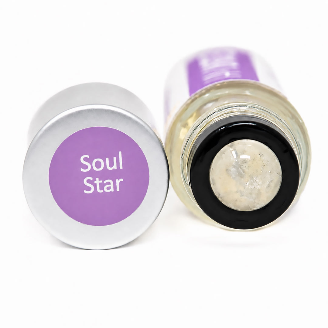 A small cosmetic or fragrance bottle with a silver cap and a purple label reading &