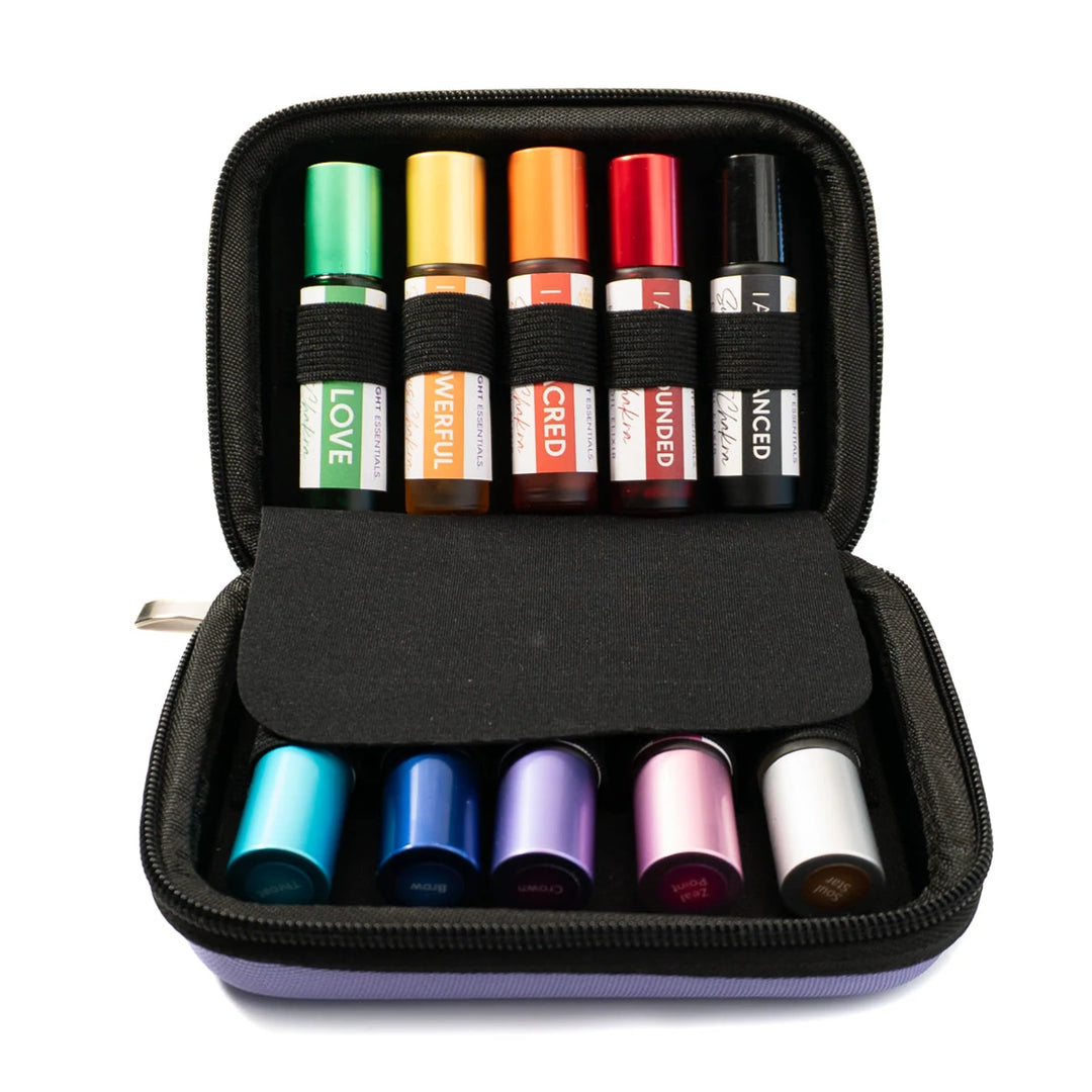 Set of colorful essential oil roller bottles organized in a purple zippered carrying case