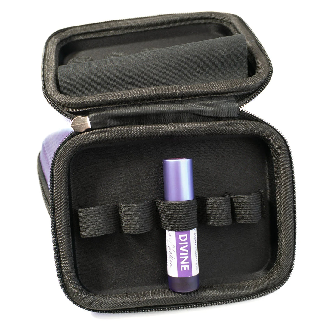 Purple travel case with zippered closure and essential oil roller labeled DIVINE
