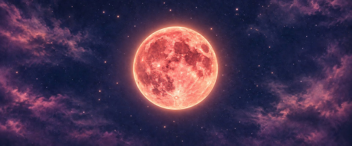 Glowing coral full moon against a violet sky filled with stars and wispy clouds.
