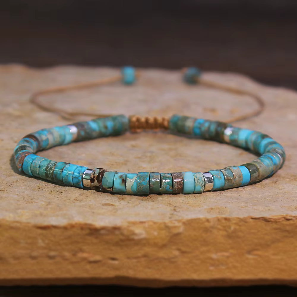 Turquoise beaded necklace on a wooden surface