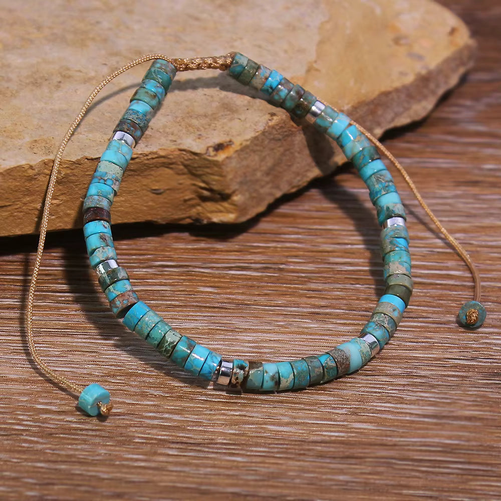 Turquoise beaded necklace on a wooden surface